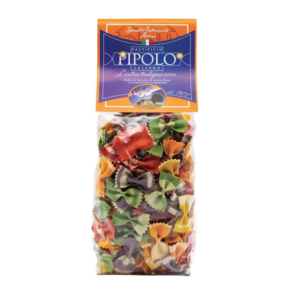 A clear plastic bag of Farfalle Spring Butterflies Pasta - 500g, with multicolored farfalle and an orange and purple “Pastificio IPOLO Salerno” label on top.