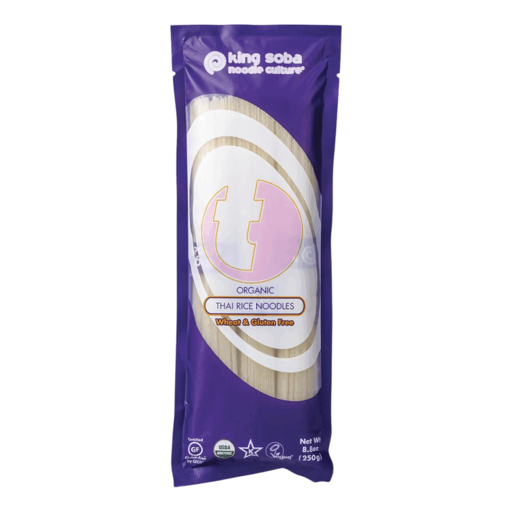 A 250g pack of King Soba Organic Thai Rice Noodles, wheat and gluten free, in a purple bag.