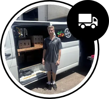 A man in a gray uniform stands next to an open white delivery van containing boxes. A truck icon appears in the top right corner.